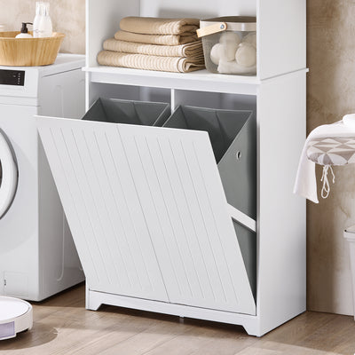Armoire de buanderie blanche avec porte basculante ouverte révélant un bac à linge gris près du lave-linge