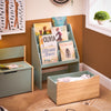 Boîte de rangement en bas pour organiser les jouets, optimisant l'espace.